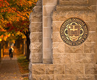 The University seal as seen from Notre Dame Avenue