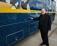 Father Tim Scully outside the ACE bus