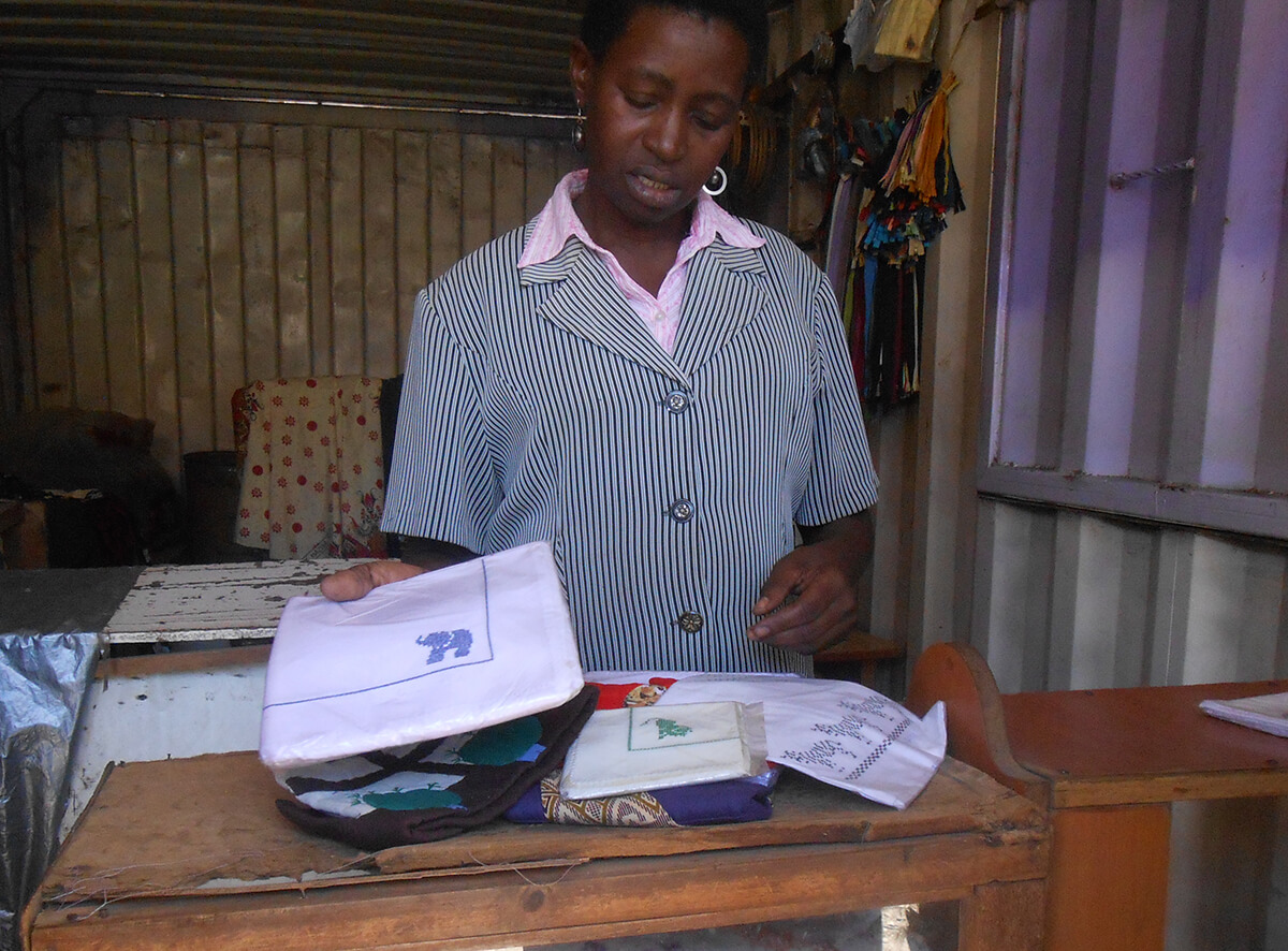 A Nairobi business owner folds garments