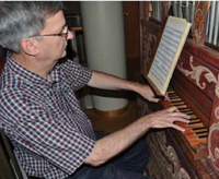 Music Professor Craig Cramer plays a 17th-century Italian chamber organ recently installed in the Reyes Organ and Choral Hall