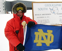 American Studies alumnus Michael Zernick ’83, proudly holds a University of Notre Dame flag at the South Pole