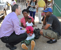 Ambassador Griffiths meets baby Anna and her family in Xai Xai, Mozambique