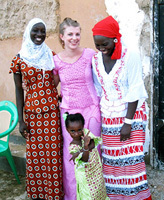 Peace Corps volunteer Lisa Floran ('09 PLS) with her host family in Senegal