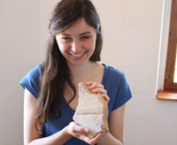 Notre Dame undergraduate Kaitlyn Farrell with a tile stamped in ancient Greek, one of the many finds from the Butrint excavation