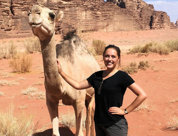 Sienna Wdowik with a camel in Jordan