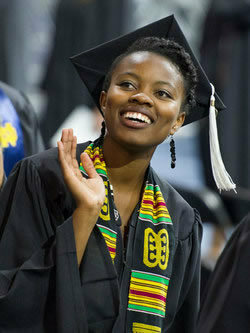 Graduating student waving