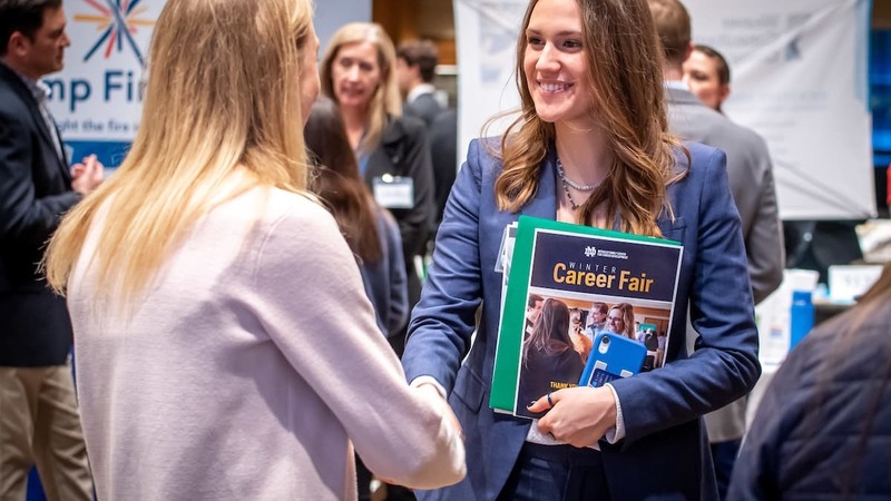 Student Shaking Hands With A Recruiter At The Career Fair