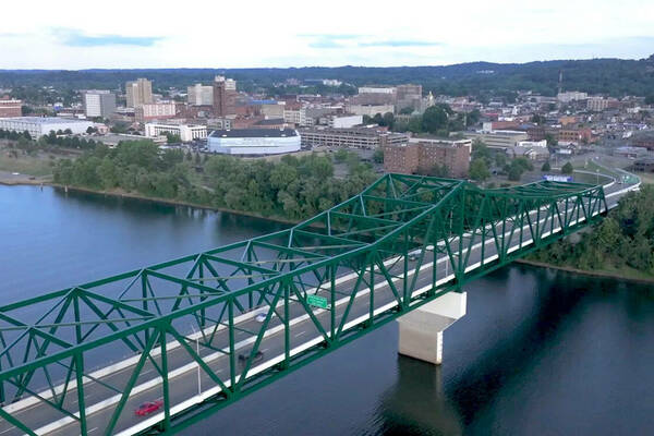 Bridge across a river, overlooking a town.