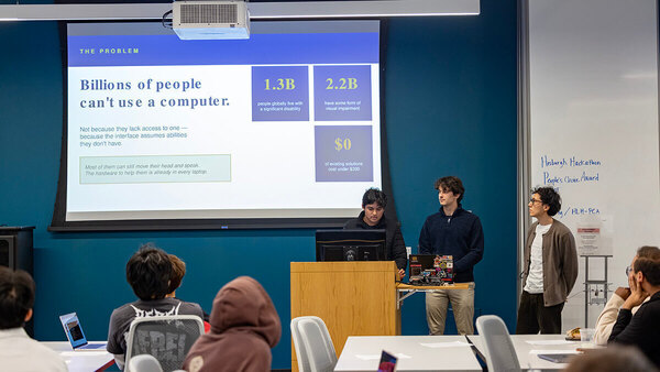 Three students present a problem statement on computer accessibility, at the Hesburgh Libraries Hackathon.