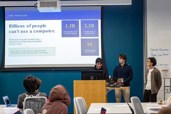 Three students present a problem statement on computer accessibility, at the Hesburgh Libraries Hackathon.