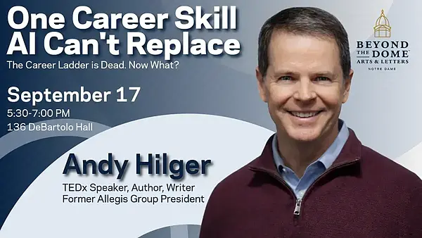Andy Hilger, smiling, in a maroon quarter-zip sweater and blue collared shirt.