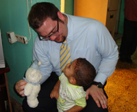 Alumnus Luke McLaurin worked to improve conditions at detention centers in Iraq. Here he visits a women's center where children of the detainees were also kept.